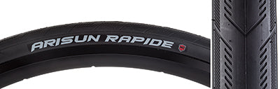 Close-up of the 700x25 Rapide Fold Bicycle Tire, showcasing its directional arrow tread design and knurled shoulder tread, highlighting the tire's enhanced cornering traction and wet weather grip.