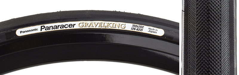 Close-up of the 700x26 Black/Black Gravel King Slick Bicycle Tire, showcasing its minimal tread and robust volume designed for versatile performance on both gravel and road surfaces.