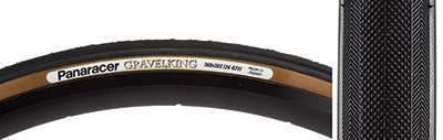 Close-up of the 700x26 Black/Brown Gravel King Slick Bicycle Tire, featuring minimal file tread and robust volume, designed for optimal performance on both roads and gravel paths.