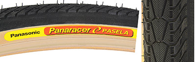 Close-up of a 700x28 Black/Tan Pasela Bicycle Tire, highlighting its hybrid commuter tread with a raised center for reduced rolling resistance.