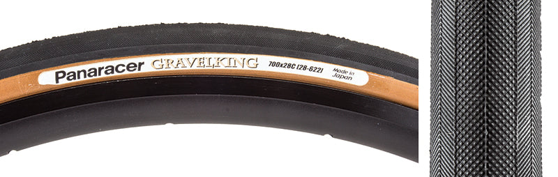 Close-up of a 700x28 Black/Brown Gravel King Slick Bicycle Tire showcasing minimal tread and robust volume, designed for road and gravel, featuring Panaracer's Natural Rubber Compound for superior grip.