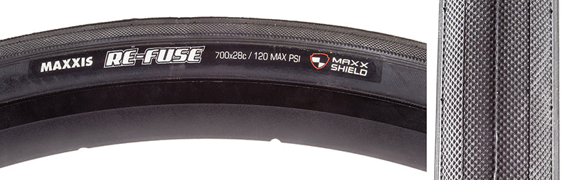 Close-up of the 700x28 Re-Fuse SC/MS Bicycle Tire, highlighting the tire's durable Kevlar belt and silkworm cap ply for puncture resistance, ideal for training with excellent traction and durability.