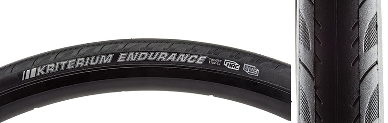 Close-up of the 700x28 Reflective Kriterium Enduro Pro Bicycle Tire, showcasing its grooved side tread and dual layer puncture protection, designed for both race and endurance training.