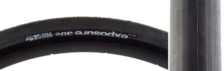 Close-up of the 700x30 Black/Black Exposure Road TCS Bicycle Tire, showcasing its file tread with stepped shoulders and corner knobs, emphasizing the advanced tubeless Supple Casing construction for a smooth ride.