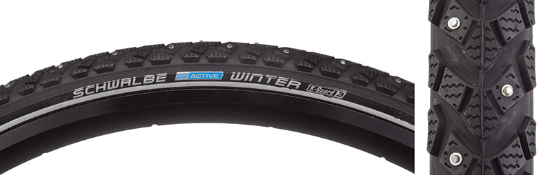 Close-up of the 700x30 Reflective Winter Active Twin K-Guard Bicycle Tire, showcasing its reduced spikes for traction, reflective striped sidewall, and protective Twin Skin coating.