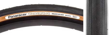 Close-up of the 700x32 Black/Brown Gravel King Slick Bicycle Tire, showcasing its minimal file tread and robust volume designed for effective performance on both road and gravel surfaces.