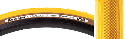 Close-up of a 700x32 Mustard Gravel King Slick Bicycle Tire, showcasing its minimal file tread and robust volume designed for versatile performance on roads, gravel, and packed dirt.