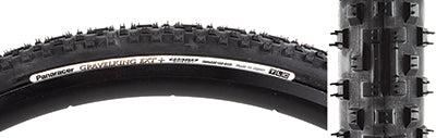 Close-up of the 700x33 Black/Black Gravel King Extreme Knobby+ Bicycle Tire showcasing its new tread pattern with vertical center blocks and ramped shoulder lugs for enhanced rolling and maximum grip.