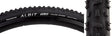 700x33 Albit Bicycle Tire close-up showing its well-spaced center lugs and offset shoulder lugs, designed for versatile performance on mixed road conditions, including mud and grass.