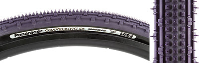 Close-up of the 700x35 Purple/Black Gravel King SK Bicycle Tire showcasing its five rows of square knobs and double rows of continuous ridges for smooth rolling and superior grip.