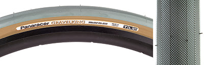 Close-up of a 700x35 Olive/Brown Gravel King Slick Bicycle Tire showcasing the minimal file tread pattern designed for versatile performance on both road and gravel surfaces.