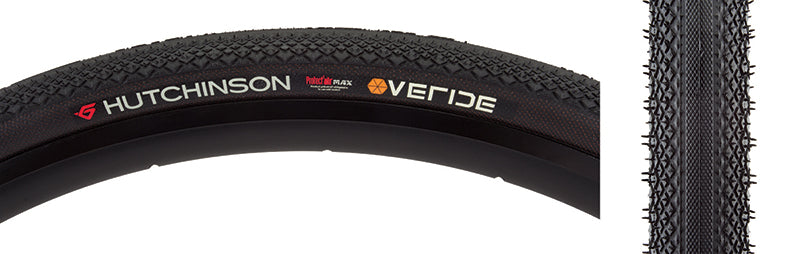 700x35 Overide Gravel Bicycle Tire, close-up of black tire with white text, featuring micro-knurled center for low rolling resistance and diamond-shaped knobs for enhanced grip on varied terrains.