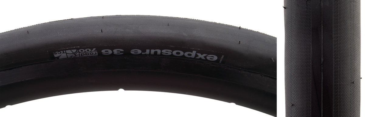 Close-up of the 700x36 Black/Black Exposure Road TCS Bicycle Tire, showcasing its tread pattern with reinforced shoulders and small corner knobs, designed for smooth, tubeless-ready performance on varied road conditions.