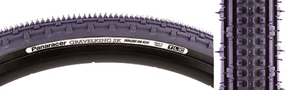 Close-up of the 700x38 Purple/Black Gravel King SK Bicycle Tire, highlighting its square knobs and continuous ridges for smooth rolling and superior grip, ideal for rough or gravel roads.