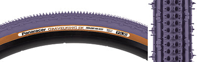 Close-up of a 700x38 Purple/Brown Gravel King SK Bicycle Tire showing five rows of square knobs and double rows of continuous ridges, designed for smooth rolling and excellent grip on rough or gravel roads.