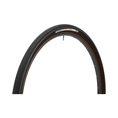 Close-up of the 700x38 Black/Black Gravel King Slick Bicycle Tire showcasing its minimal file tread and robust volume, designed for enhanced grip on both roads and gravel paths.