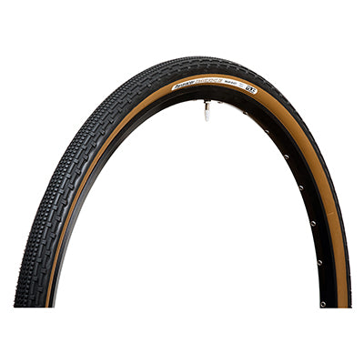 700x38 Black/Brown Gravel King SK+ Bicycle Tire with flat tire, featuring five rows of square knobs and double rows of continuous ridges, designed for smooth rolling and excellent grip on rough or gravel roads.