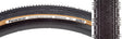 Close-up of the 700x38 Black/Brown Gravel King SS Bicycle Tire, showcasing its fast-rolling file tread down the center with micro knobs and long rectangular shoulder knobs for mixed gravel and road use.