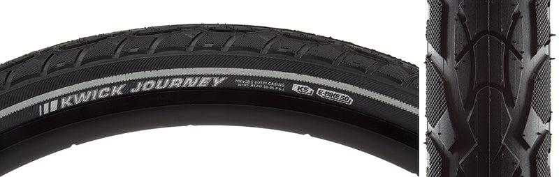 Close-up of the 700x38 Reflective Kwick Journey Sport KS Bicycle Tire, showcasing its knurled shoulders, deep siping, and reflective sidewall accents for improved safety and durability.