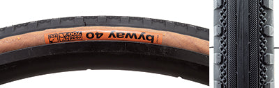 Close-up of a 700x40 Black/Tan Byway TCS Bicycle Tire showing its smooth centerline, small diamond-shaped peaks, and substantial shoulder knobs for enhanced traction.