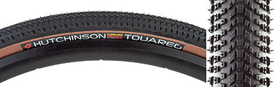 Close-up of the 700x40 Black/Tan Touareg Bicycle Tire, showcasing its densely packed small knobs and round profile designed for high grip and low rolling resistance on both pavement and off-road surfaces.