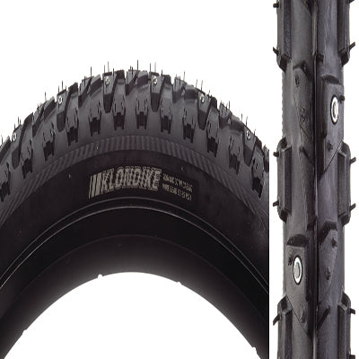 Close-up of the 700x40 Klondike Skinny Sport Bicycle Tire, showcasing its updated tread design with alternating tungsten carbide-tipped studs, suitable for winter cyclocross or commuter bicycles.