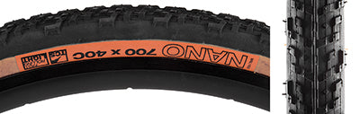 Close-up of the 700x40 Black/Tan Nano TCS Light Fast Rolling Bicycle Tire, highlighting its detailed tread pattern and orange label, designed for optimal efficiency and durability on mountain bike trails.