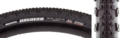 700x40 Ravager DC/EXO/TR Bicycle Tire close-up showcasing its raised square-edged center knobs and oversized cornering knobs, designed for optimal traction on trails with EXO sidewall protection and Tubeless Ready casing.