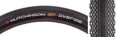 Close-up of the 700x45 Overide Gravel Bicycle Tire's tread, featuring micro-knurled center line and low profile diamond-shaped knobs designed for low rolling resistance and optimal grip on gravel and road conditions.