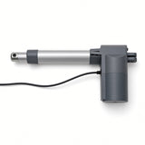 A linear electric actuator with a silver metal rod, dark gray plastic components, and a black power cable, shown on a clean white background.