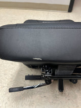 18 Black Vinyl Molded Seat Assembly for Pride Mobility Scooters, featuring a black armrest, padded seat and backrest, and sturdy metal frame, ideal for comfortable and durable scooter seating.