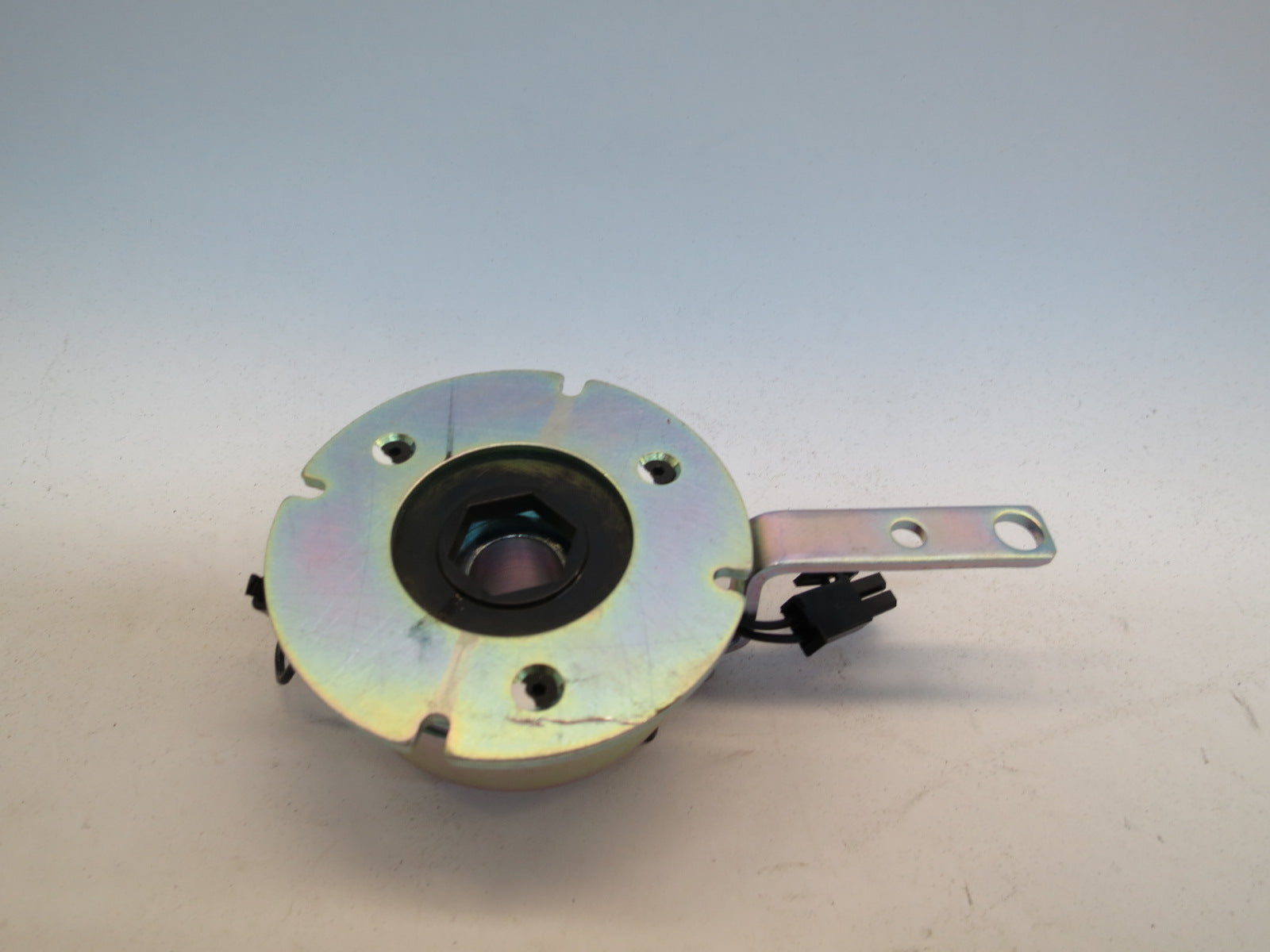 Brake Assembly for the Pride Celebrity X (SC4001/SC4401) & Mega Motion Endeavor X (MM4001DX/MM4401DX) with visible metal circular component and screw, highlighting its missing hardware.