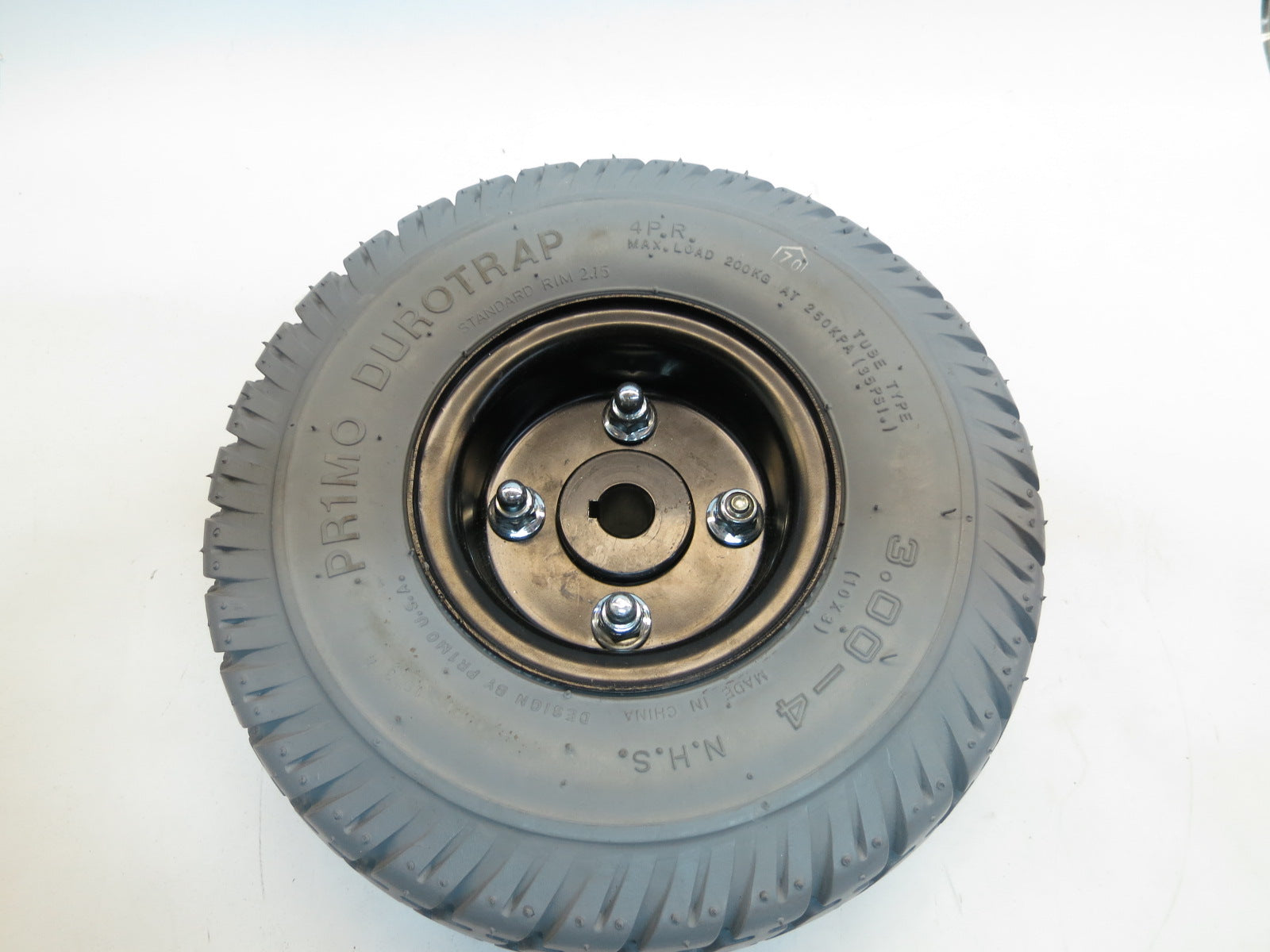 3.00-4 (10x3, 260x85) Flat-Free Drive Wheel Assembly for the Jazzy Z11 (Blemished) showing a close-up of the wheel with a central screw, split rim design, and replaceable tire.