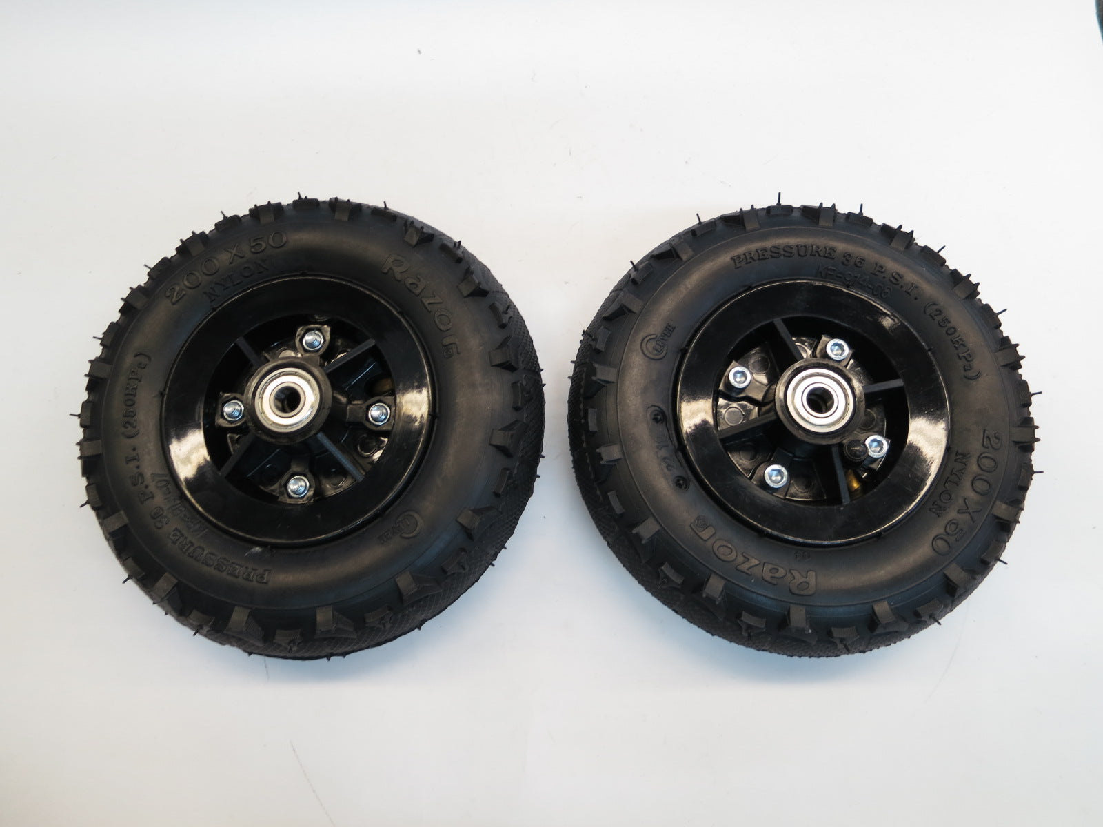 Razor Dune Buggy Front Wheels (Set of 2) featuring semi-knobby 200x50 tires with metal centers, inner tubes, and wheel bearings, ideal for front wheel assemblies.