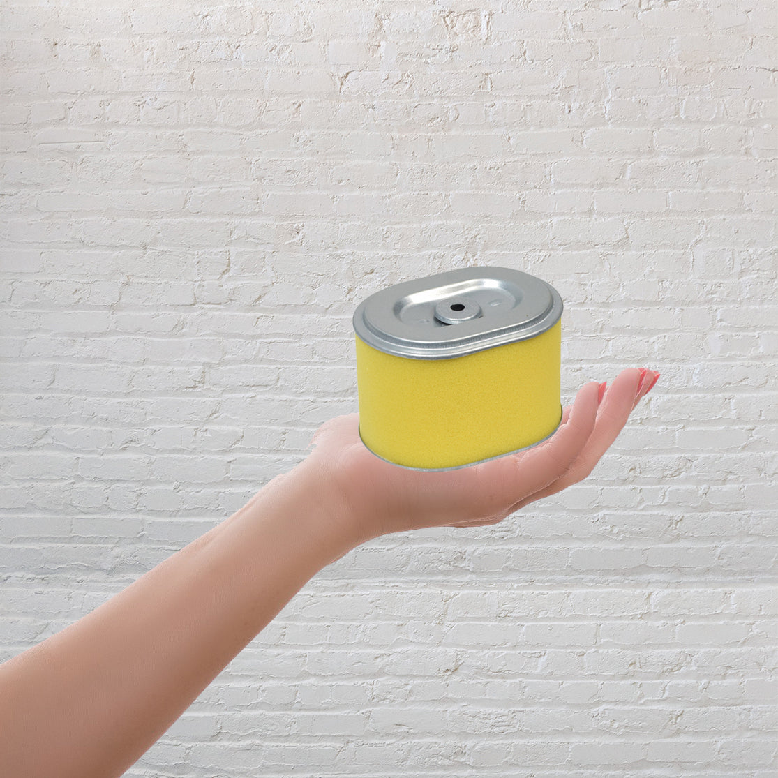 A hand holding a yellow can labeled Carburetor with 24 mm Air Intake for 163cc 5.5 Hp & 196cc 6.5 Hp Baja Go-Kart Engines.