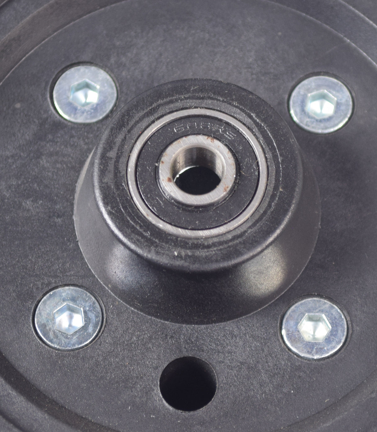 Caster Wheel Assembly for the ActiveCare Catalina and Intrepid Power Chairs, featuring a black circular object with a round center and visible screws, designed for mobility enhancement.