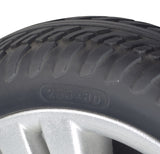 Close-up of the Flat-Free Black Front Wheel Assembly for the ActiveCare Pilot 2410 Mobility Scooter, showcasing the tire tread and 6202Z size bearings, ready to bolt on.