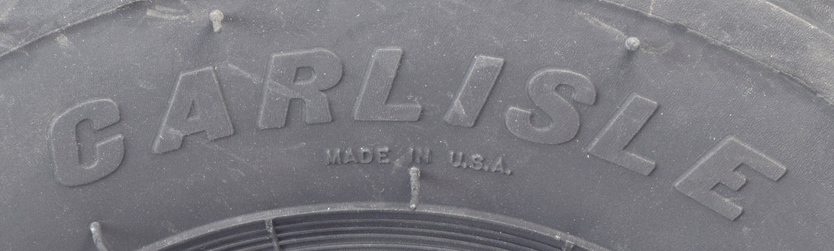 Close-up of the Carlisle 18x9.50-8 Rear Tire with Knobby Tread for Manco Go-Karts, showcasing aggressive center-dimple knobs designed for superior traction on rough terrain.