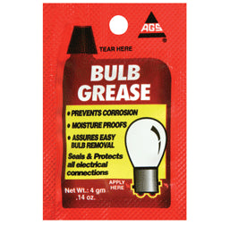 Close-up of a package labeled Dielectric Bulb Grease - Single-Use 4g Pouch, designed to seal and protect electrical connections, extending bulb lifespan and improving performance.