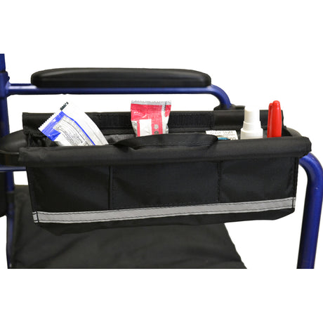 Armrest Pocket for Wheelchairs, Mobility Scooters, & Power Chairs shown in black nylon with multiple items stored inside, including a white plastic container and other accessories, highlighting its spacious design and functionality.