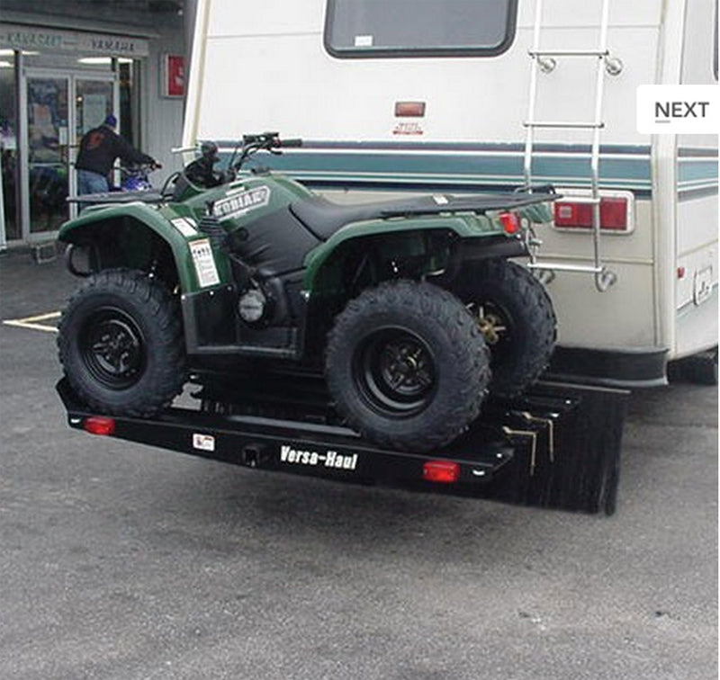 ATV and Go-Kart Carrier on a trailer, showcasing its sturdy steel build and wide tire compatibility, designed for transporting off-road vehicles with ease.