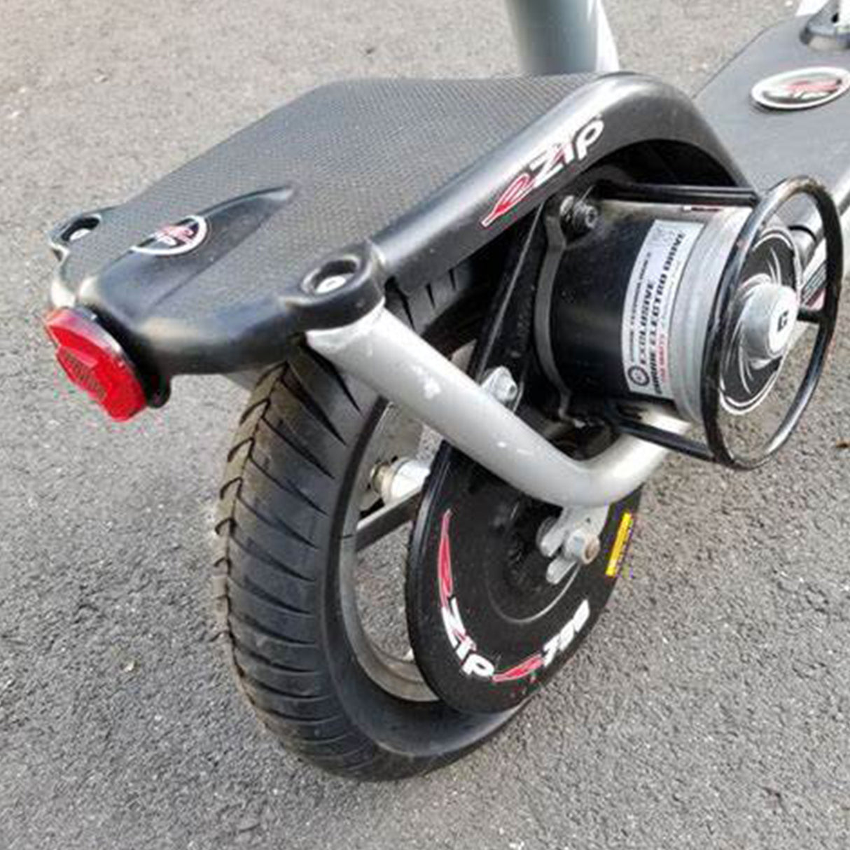 12-1/2x2.75 Tire with Knobby Tread for the Hyper HPR 350 Electric Motorcycle, displayed on a black scooter, showcasing its rugged tread designed for off-road use.