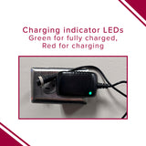 12 Volt 1.0 Amp (1000 mA) 3-Prong Battery Charger, black with green LED indicator, plugged into a wall outlet, close-up view showing the charging status.