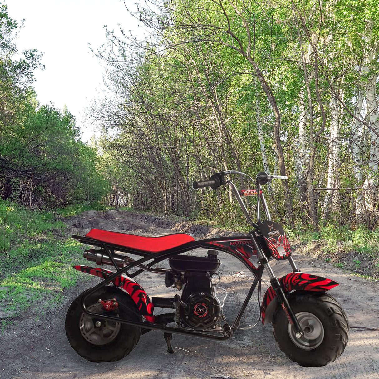 145/70-6 Tire with V-Tread for the Baja Blitz, Dirt Bug, Doodle Bug, & Racer Mini Bikes on a dirt road, showcasing its aggressive tread pattern suitable for muddy, sandy, and gravel surfaces.