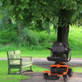 24 Volt 3.5 Amp XLR 24BC3500T-4 Battery Charger in a park setting, near a green bench and a black and orange scooter, designed for mobility applications.