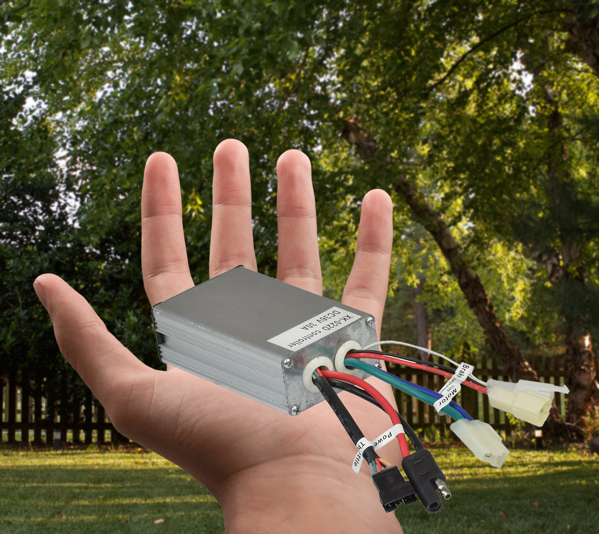 Hand holding the Currie 36 Volt 5-Pin 5-Connector Controller, showing wires and connectors for eZip, IZIP, GT, Mongoose, and Schwinn Scooters, with diagnostic voltage controller and PWM Smart Power Microprocessor.