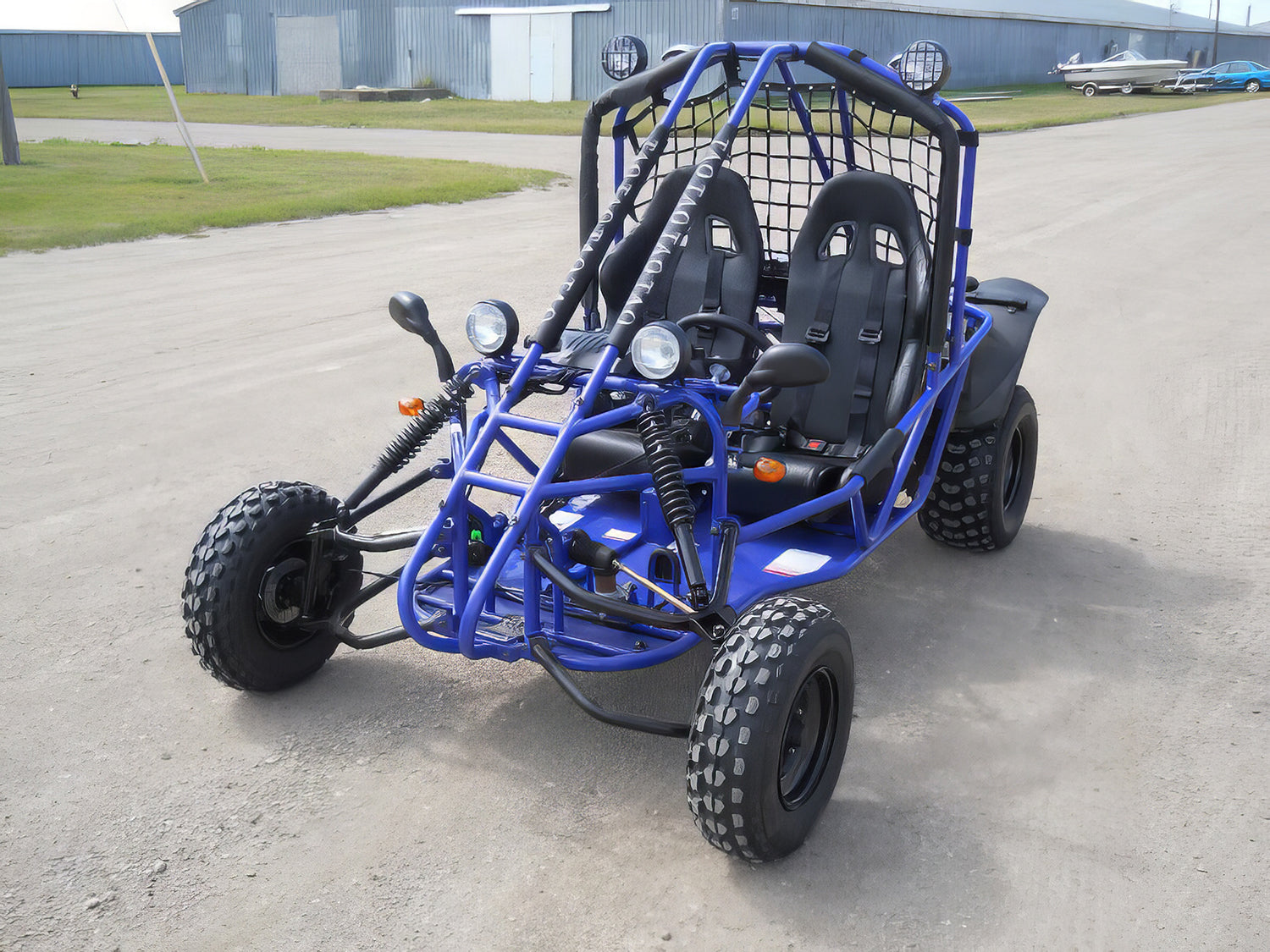 Front Fender Set for 150cc - 250cc Go-Karts (Set of 2), featuring two black plastic mud shields, mounted on a blue buggy's front, showcased on a road.