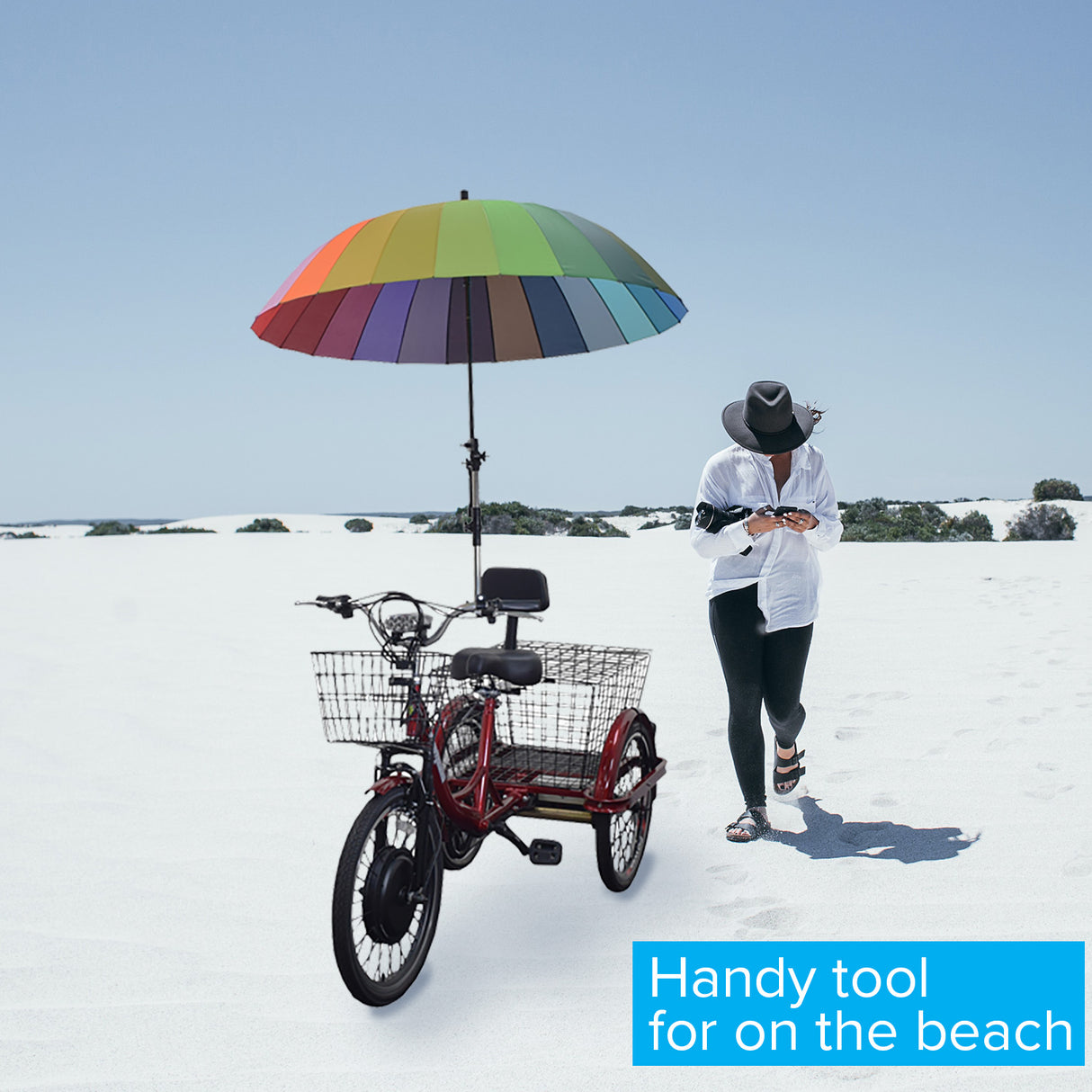 Universal Grip Umbrella Holder for Bikes & Kick Scooters shown attached to a bicycle handlebar, with a person holding a rainbow umbrella while walking beside the bike.