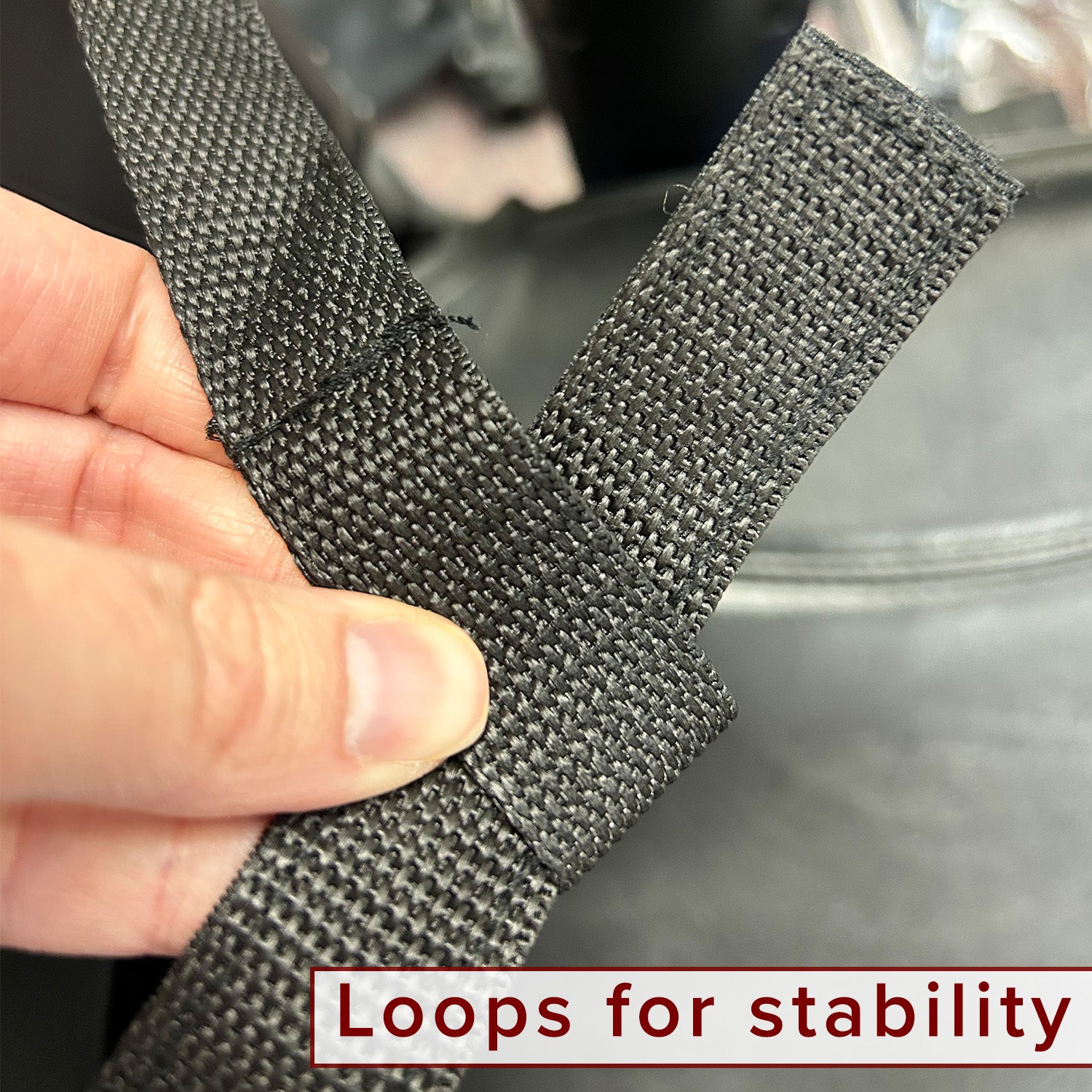 Universal Walker Holder for Mobility Scooters shown being held, highlighting black strap and durable fabric used for securing a walker to mobility scooters, ensuring ease of use and accessibility.