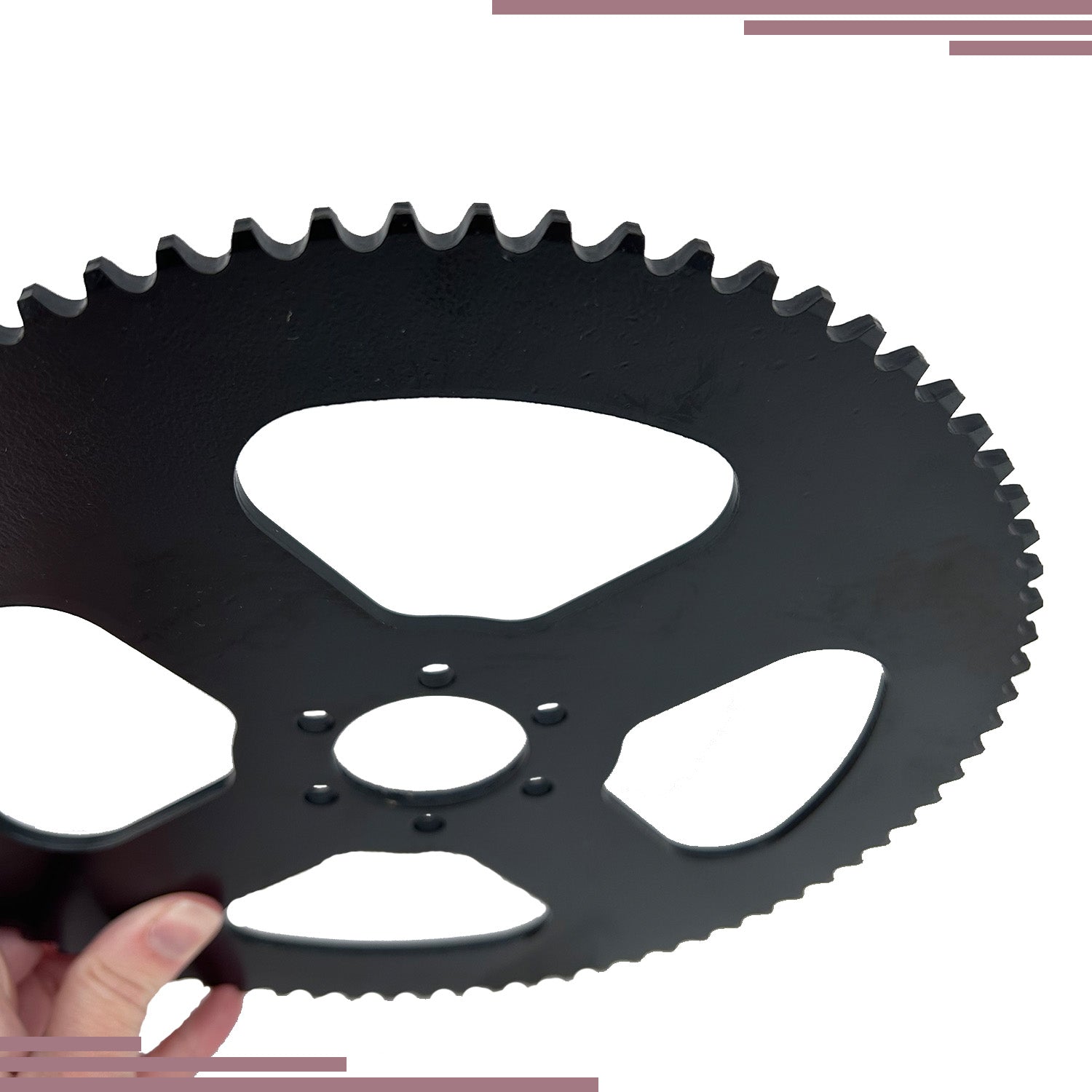 Hand holding a 75 Tooth #35 Chain Rear Wheel Sprocket for the Oryxearth 105CC 4-Stroke Mini Bike, showcasing the black gear's six inner mounting holes.